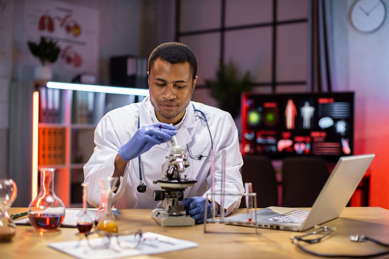 young African American male researcher looking at